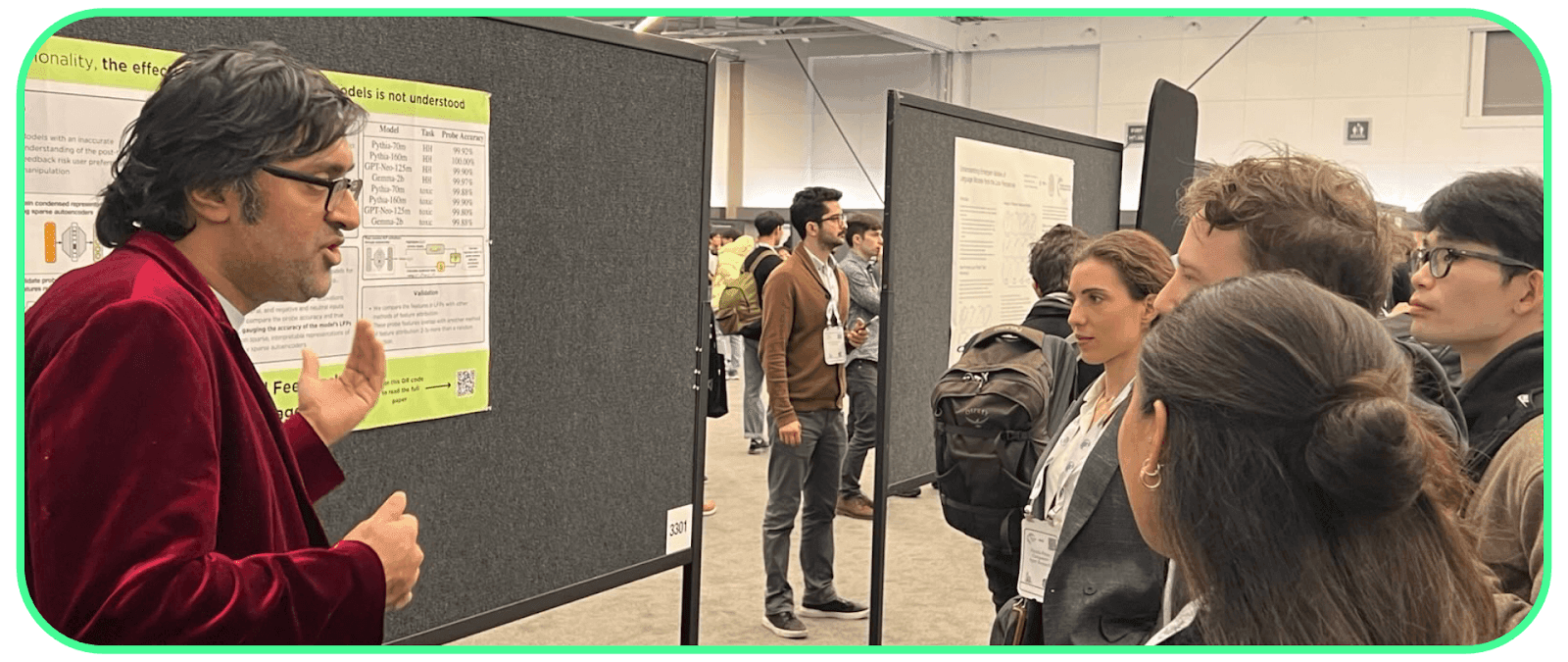 Amir (left) presenting at NeurIPS 2024